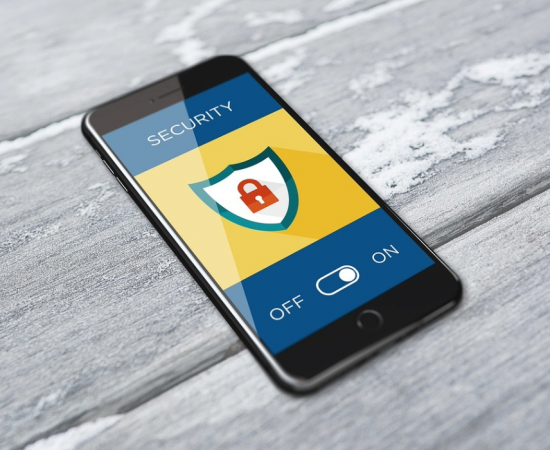 Phone with cybersecurity Icon on screen.